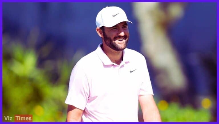 Scottie Scheffler smiles in a white Nike cap and light pink polo. The background is a golf course.